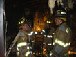 FF Buckingham and FF D'Alonzo surveying the damage