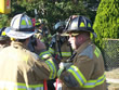 Batt. Chief Stagliano and FF Brandt discuss the conditions on the fire scene
